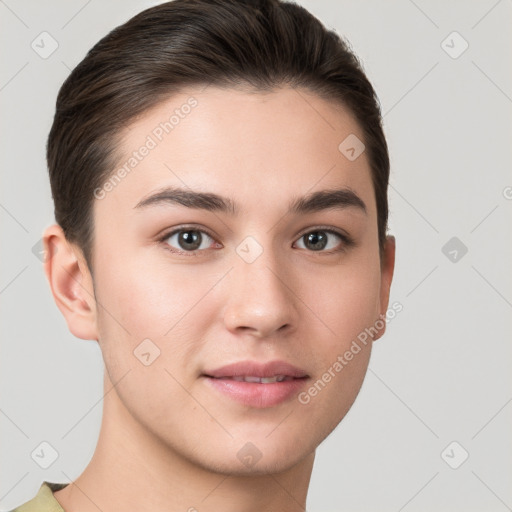 Joyful white young-adult female with short  brown hair and brown eyes