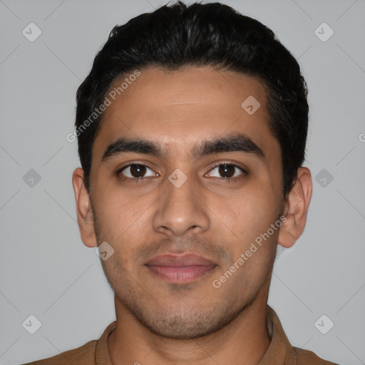 Joyful latino young-adult male with short  black hair and brown eyes