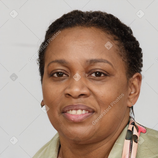 Joyful latino adult female with short  brown hair and brown eyes