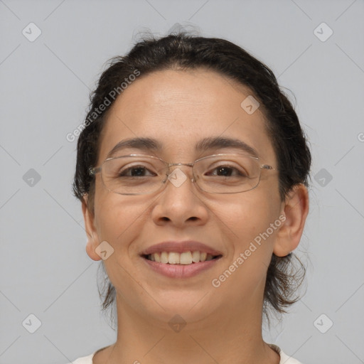 Joyful white adult female with medium  brown hair and brown eyes