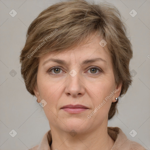 Joyful white adult female with medium  brown hair and grey eyes