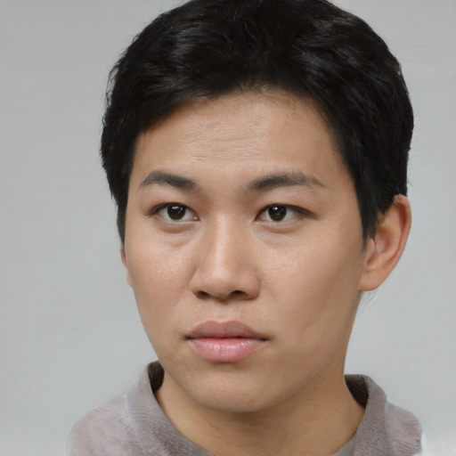 Neutral asian young-adult male with short  black hair and brown eyes