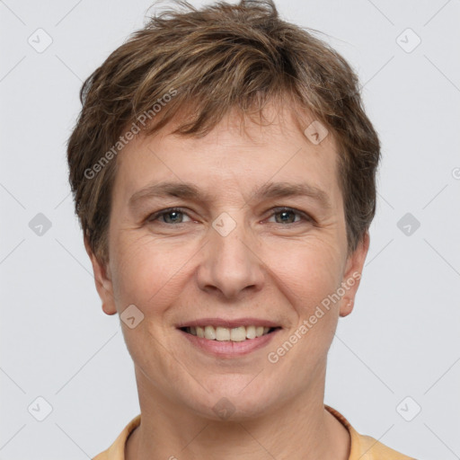 Joyful white adult male with short  brown hair and grey eyes