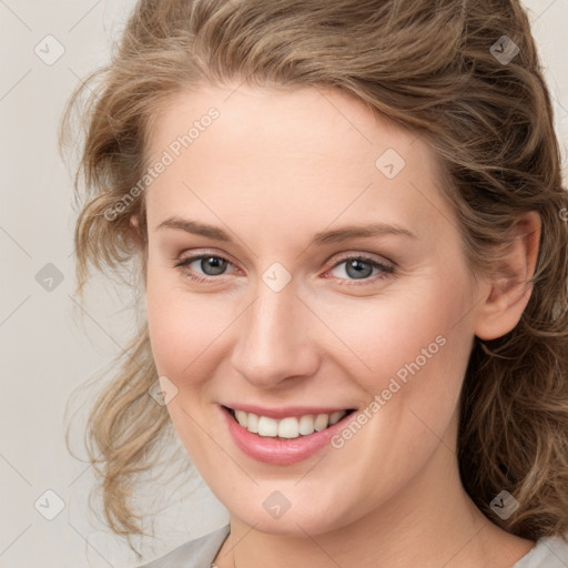 Joyful white young-adult female with medium  brown hair and blue eyes