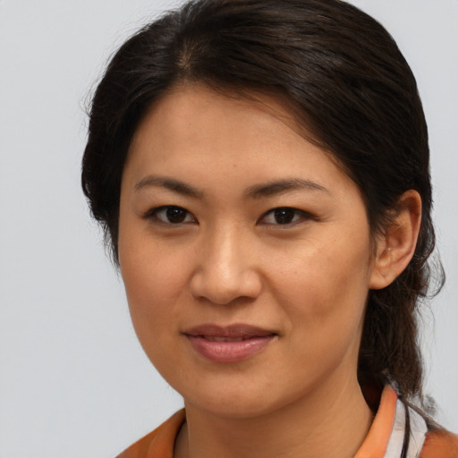 Joyful asian young-adult female with medium  brown hair and brown eyes