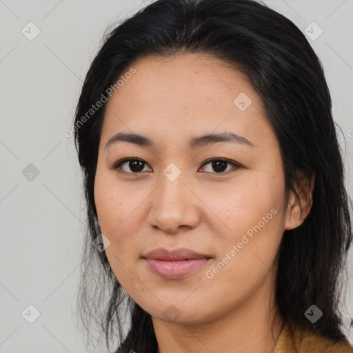 Joyful asian young-adult female with long  brown hair and brown eyes