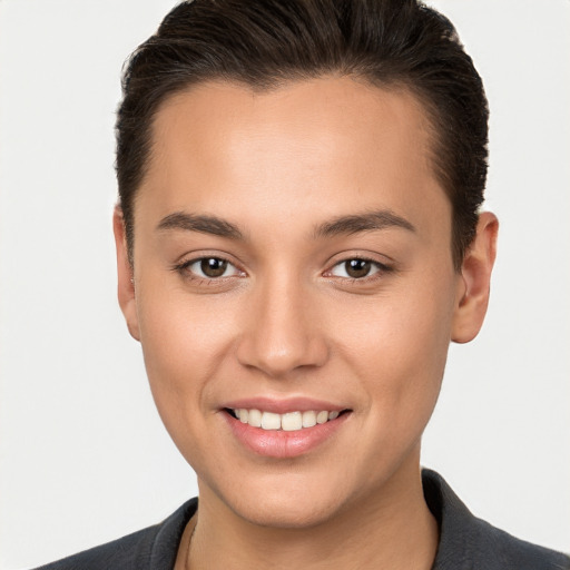 Joyful white young-adult female with short  brown hair and brown eyes