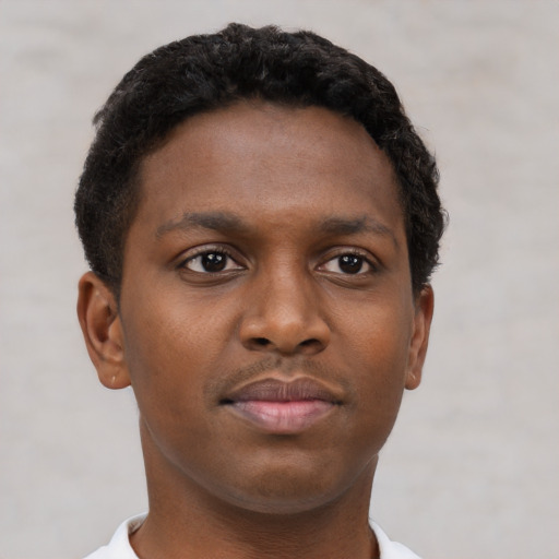 Neutral black young-adult male with short  brown hair and brown eyes