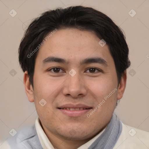 Joyful asian young-adult male with short  brown hair and brown eyes