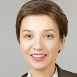 Joyful white young-adult female with short  brown hair and grey eyes