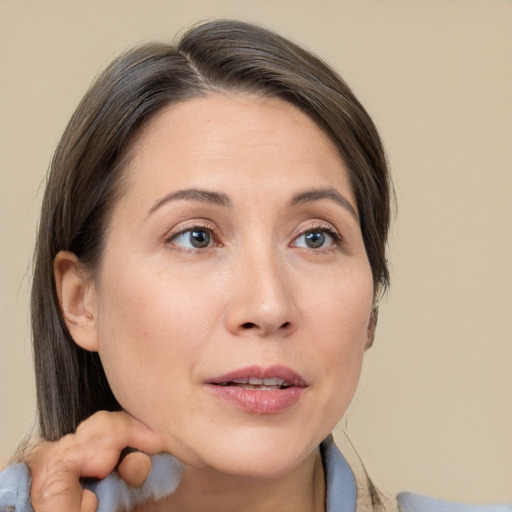 Neutral white adult female with medium  brown hair and brown eyes