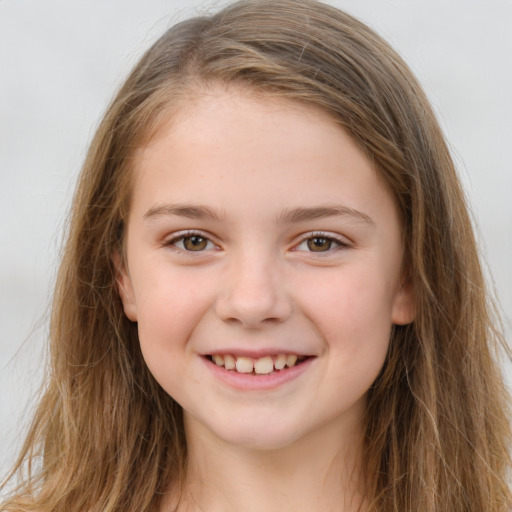 Joyful white child female with long  brown hair and brown eyes