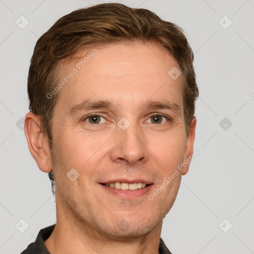 Joyful white adult male with short  brown hair and grey eyes