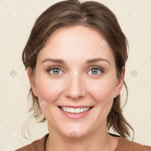 Joyful white young-adult female with medium  brown hair and green eyes