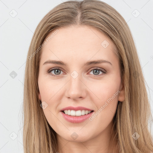 Joyful white young-adult female with long  brown hair and green eyes