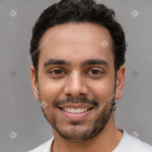 Joyful white young-adult male with short  black hair and brown eyes