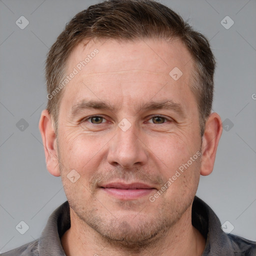 Joyful white adult male with short  brown hair and grey eyes