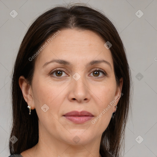 Joyful white adult female with medium  brown hair and brown eyes