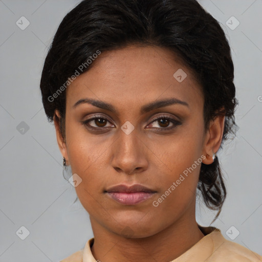 Neutral black young-adult female with medium  brown hair and brown eyes