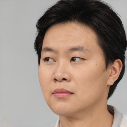 Neutral asian young-adult male with short  brown hair and brown eyes