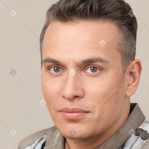 Joyful white adult male with short  brown hair and brown eyes