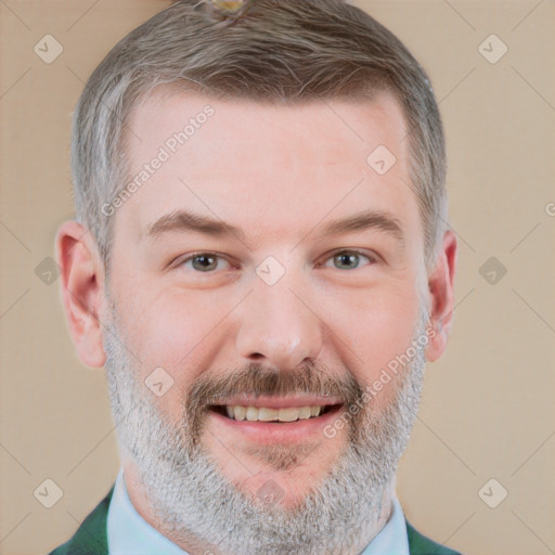 Joyful white adult male with short  brown hair and grey eyes