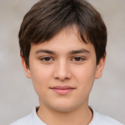 Joyful white child male with short  brown hair and brown eyes