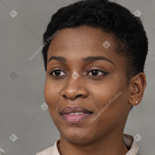 Joyful black young-adult female with short  brown hair and brown eyes