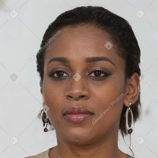 Joyful black young-adult female with medium  brown hair and brown eyes