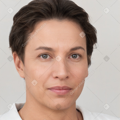 Joyful white adult female with short  brown hair and brown eyes