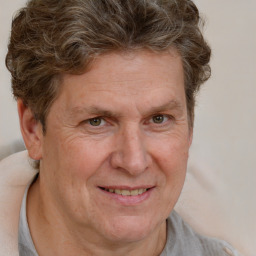 Joyful white middle-aged male with short  brown hair and brown eyes