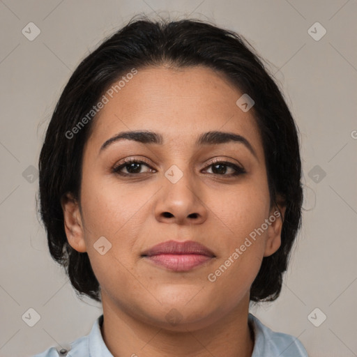 Joyful latino young-adult female with medium  brown hair and brown eyes