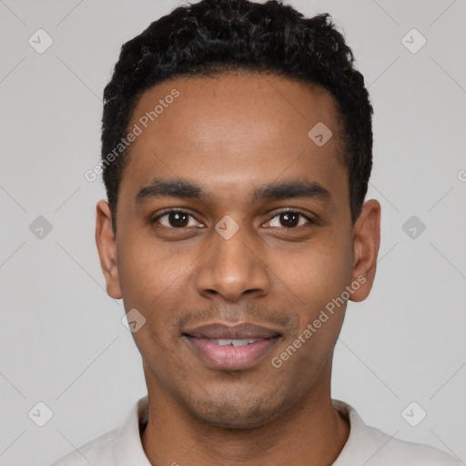 Joyful black young-adult male with short  black hair and brown eyes