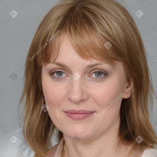 Joyful white young-adult female with medium  brown hair and blue eyes