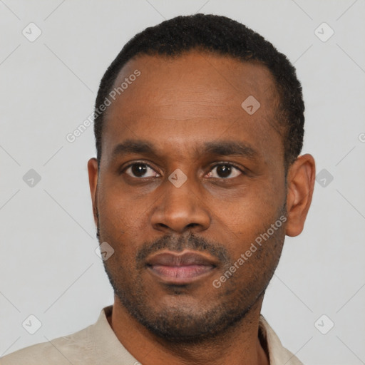 Neutral latino young-adult male with short  black hair and brown eyes