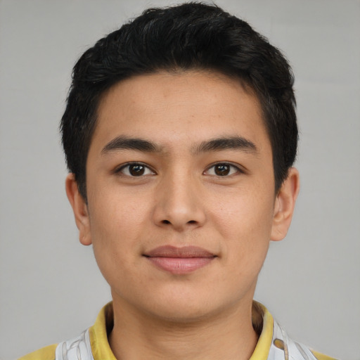 Joyful asian young-adult male with short  brown hair and brown eyes