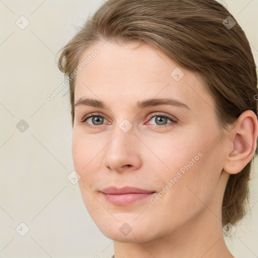 Joyful white young-adult female with medium  brown hair and green eyes