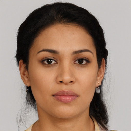 Joyful latino young-adult female with medium  black hair and brown eyes