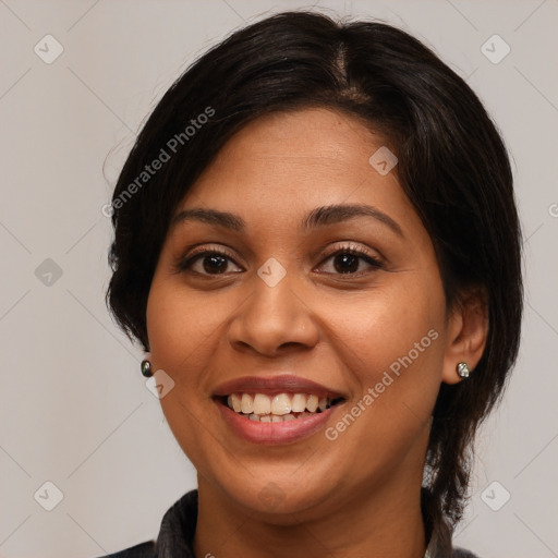 Joyful latino young-adult female with medium  brown hair and brown eyes