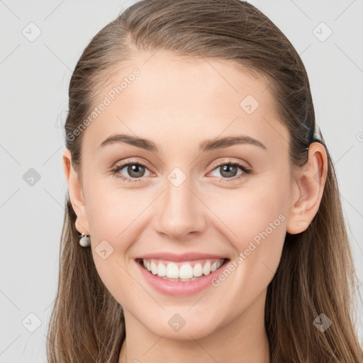 Joyful white young-adult female with long  brown hair and grey eyes