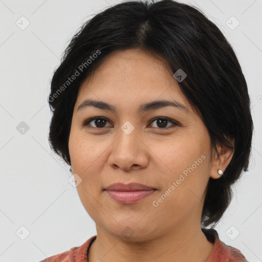 Joyful asian adult female with medium  brown hair and brown eyes