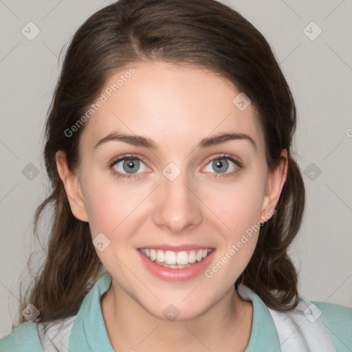 Joyful white young-adult female with medium  brown hair and green eyes