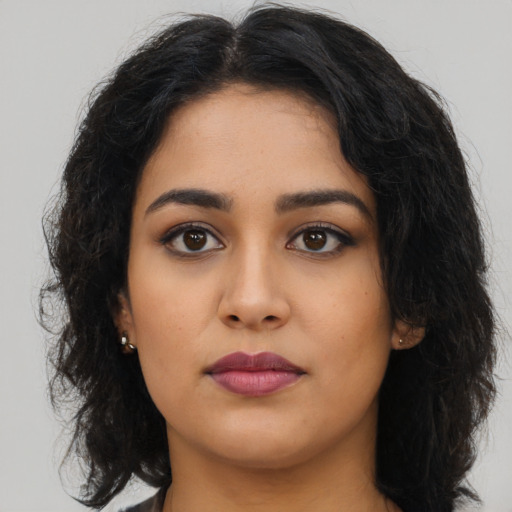 Neutral latino young-adult female with long  brown hair and brown eyes