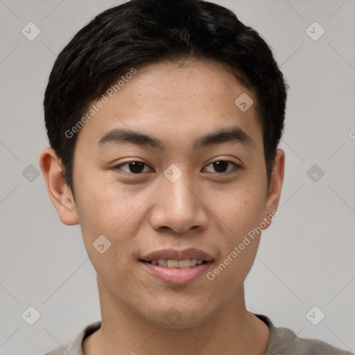 Joyful asian young-adult male with short  brown hair and brown eyes