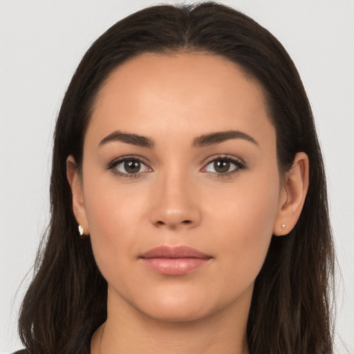 Joyful white young-adult female with long  brown hair and brown eyes