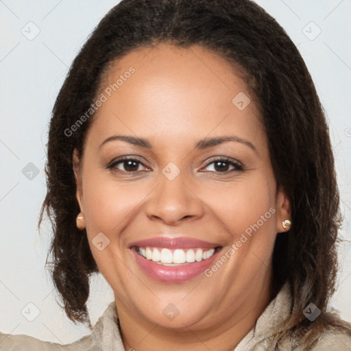 Joyful latino young-adult female with long  brown hair and brown eyes