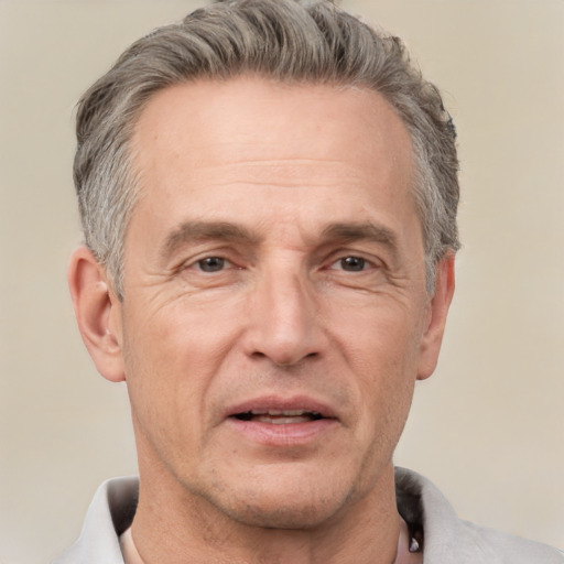 Neutral white middle-aged male with short  gray hair and brown eyes