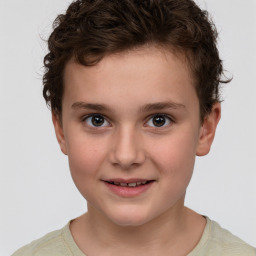 Joyful white child male with short  brown hair and brown eyes