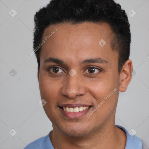 Joyful latino young-adult male with short  black hair and brown eyes