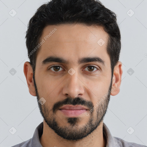 Joyful latino young-adult male with short  black hair and brown eyes